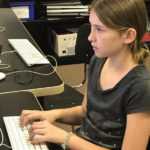 Elementary student writing code at Garden Street Academy