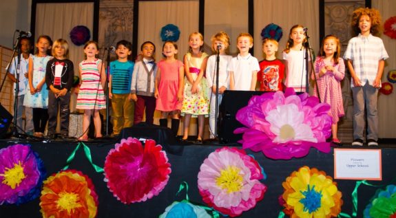Lower School Students Singing on Stage at Spring Into The Arts 2016