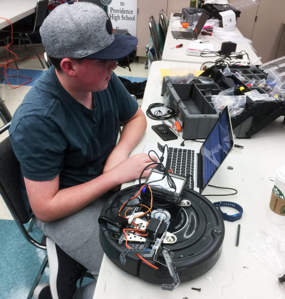 High School Student Programming Robot at Garden Street Academy Robotics Team Botball Workshop